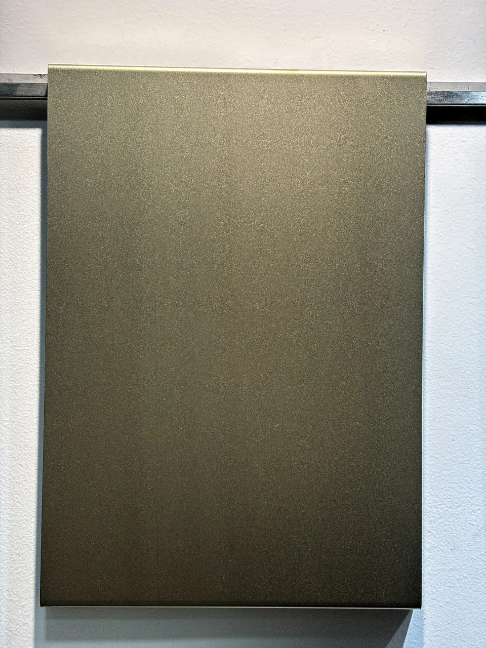Bead blast stainless steel panel in an antique brass tone