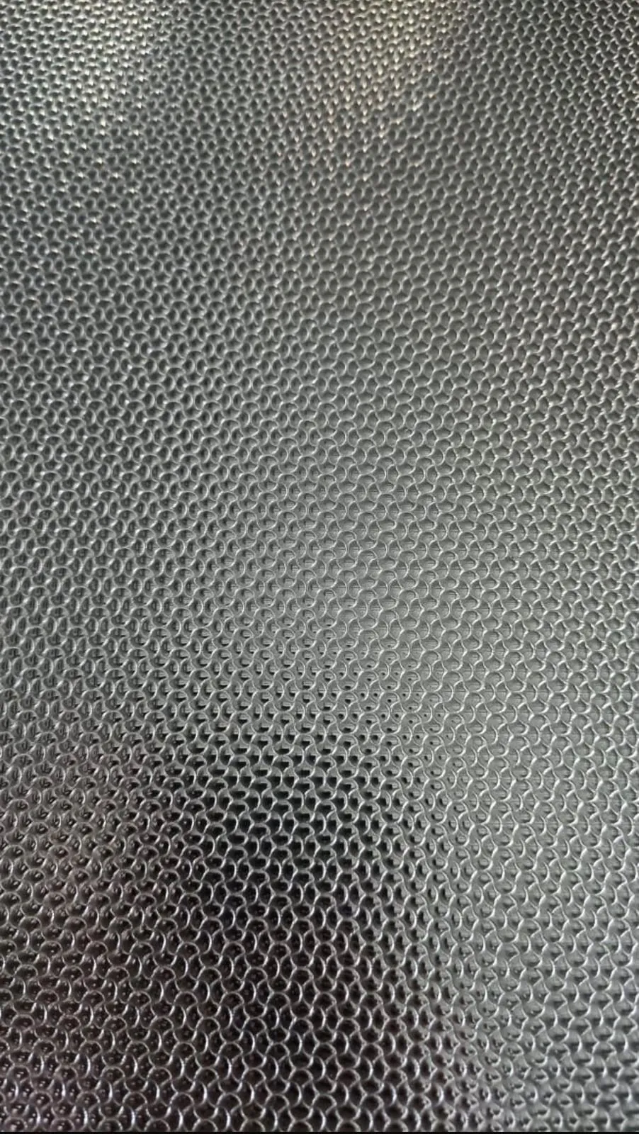 Close-up of an embossed stainless steel texture